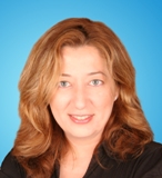 Photo of Website Manager Internet Consultant SEO Expert SEO Website Designer Web Marketer Theodora Dimou with blue background who is based in Toronto, Ontario, Canada and the owner of Dora's Web World